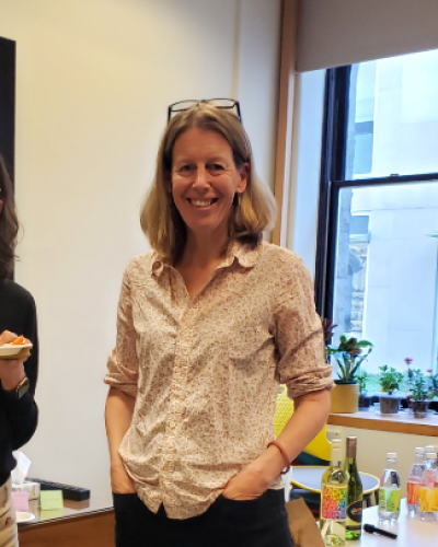 Jocelyn Holland (Caltech) talking to attendees at the Institute for German Cultural Studies colloquium reception.